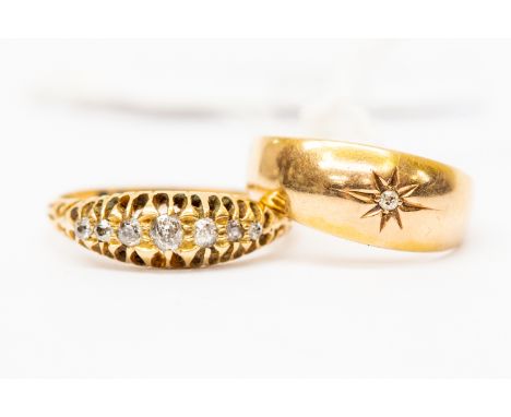 An 18ct gold and diamond seven stone boat head ring, size M, total gross weight approx 2.7gms; together with an 18ct gold and