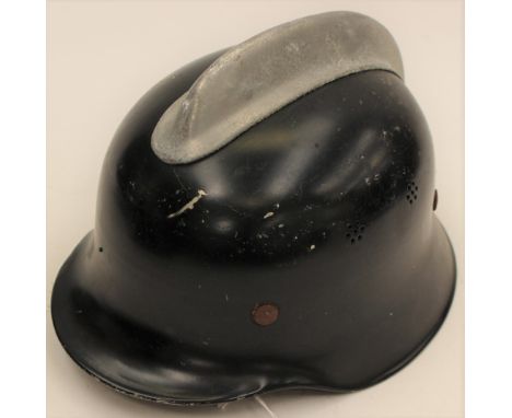 West German M34 Fire Helmet. Alloy comb to crown. Original black paint. Marked "DIN14940". Complete with leather neck protect