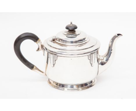 A George VI Walker and Hall sterling silver Art Deco teapot, Sheffield 1937, of cylindrical form, with raised engine turned d