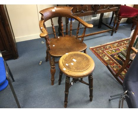 Turn of the century Oak elbow chair together with a wooden stool with turned legs.