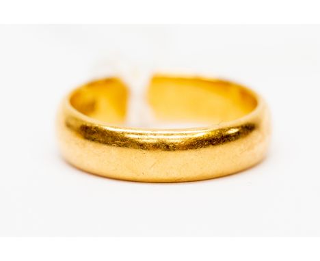 A 22ct gold band, size K, weight 4.9gms