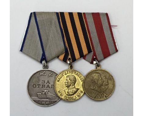 WW2 and later Soviet Russian medal group, mounted for wear.To include: a Medal for Courage, Medal for Victory over Germany in