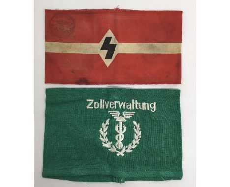 2 German armbands.One in printed cotton with chain stitched edging, and issue stamped to the front and back.Notes: depending 
