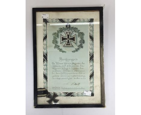 WW1 era German Iron Cross 2nd class, with period award certificate (the whole group is framed and glazed).The Iron Cross is o