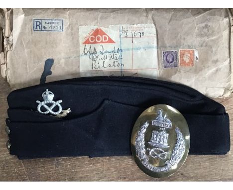 An original British Army navy blue coloured field service cap with original issued envelope with officers cross belt plate, (