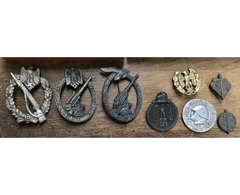 A selection of German / Austro-Hungarian medals and badges.To include: a WW1 iron cross 2nd class, of 3 piece construction (r