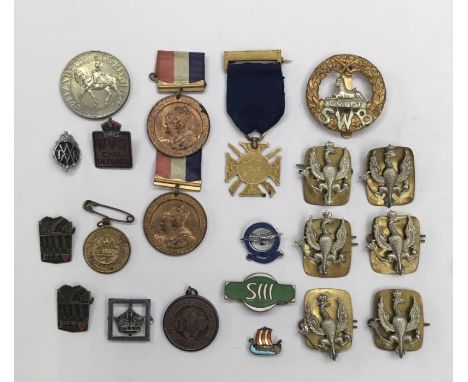 A selection of Victorian and later medallions and badges.To include: a scarce 55th (Leigh) Lancashire Rifle Volunteers gilt g