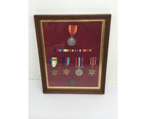 A glazed and framed WW2 / Fire Brigade Long Service Medal group.To include: Atlantic Star with France & Germany clasp, 1939-1