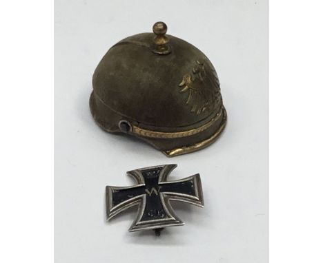 An unusual and rare WW1 German miniature Pickelhaube presentation box with an 800 silver grade Iron Cross 1st class.The box h