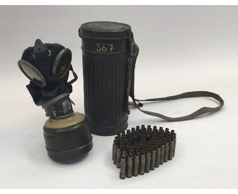 A WW2 German gas mask with tin, plus a NATO bullet belt.Cylindrical and ribbed carry tin with original paint.Painted with the