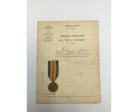 WW1 French official issue Victory medal, with accompanying certificate named to ‘Marcle Jean Baptiste’ and dated seemingly da