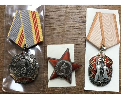 Russian medal orders of The Order of Labour Glory 3rd Class, Order of the Red Star (damage to enamel) and Order of Badge of H