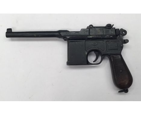 A reproduction 1896 broom handle Mauser pistol by Denix.Suitable for use as a film prop or for reenactment purposes.The pisto
