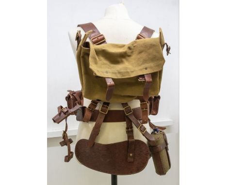A set of British 1914 pattern leather equipment comprising of a waist belt, support braces, two ammunition pouches, a bayonet