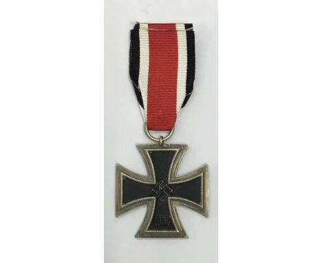 WW2 Iron Cross 2nd Class.Usual 3 part construction, with magnetic iron core and silvered rim.Stamped with maker mark ‘44’ to 