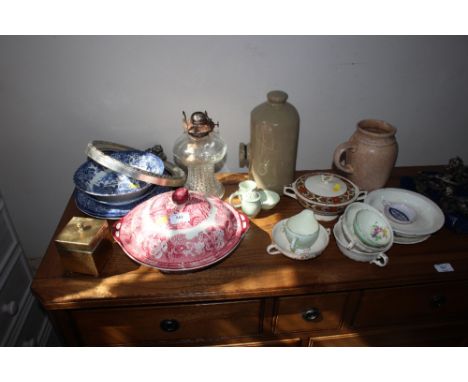 A quantity of china to include an English Scene patterned tureen and cover; Stoneware hot water bottle; an oil lamp etc