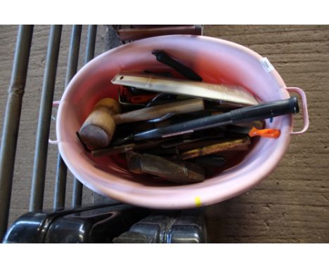 A plastic tub of various tools