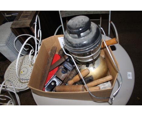 A box containing a paraffin lamp and a quantity of various tools 