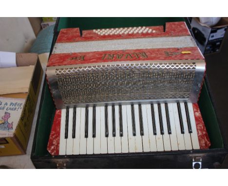 An Alvari piano accordion in carrying case