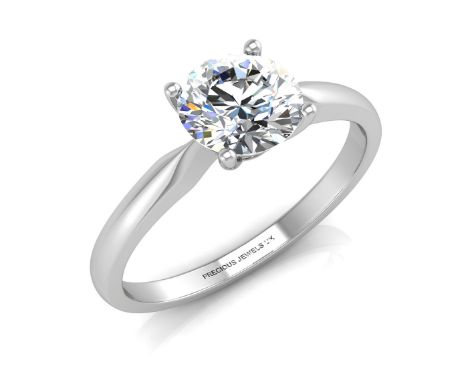 A stunning natural round brilliant cut diamond in a 18ct white gold ring with a white gold four claw setting. This perfect en