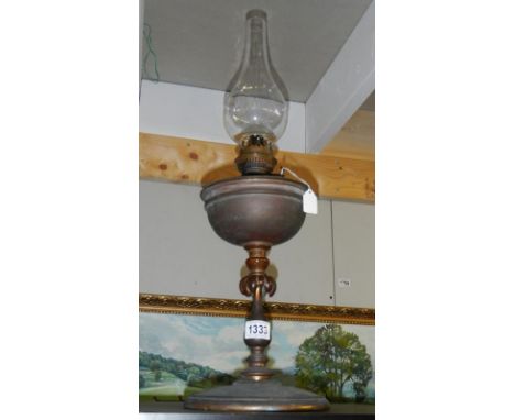 An Arts &amp; Crafts unrestored oil lamp circa 1910. Plain copper standard with typical Arts &amp; Crafts design floral centr