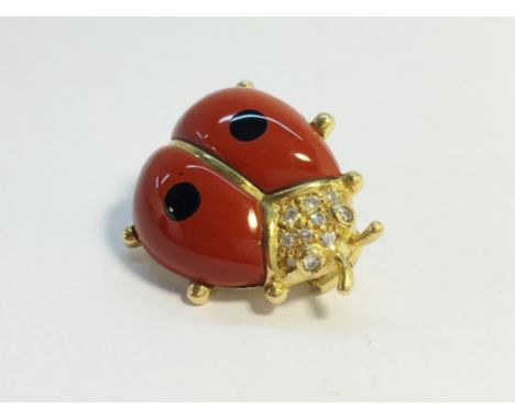 An 18ct yellow gold enamel and diamond ladybug brooch. 4.3 grams. Missing 1 diamond