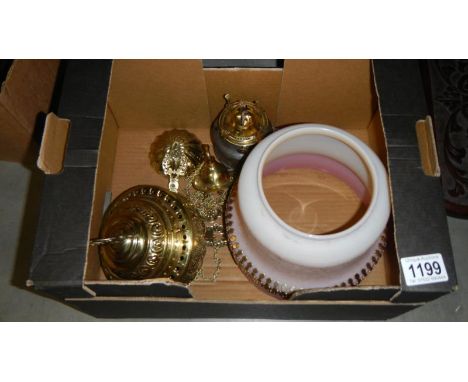 An Indian brass hanging lamp with shade.