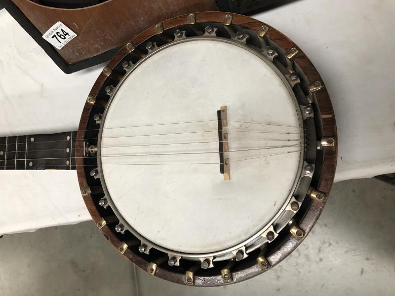 A 19th century "The Windsor" banjo with inlaid back.