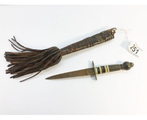 A small dagger in sheath.