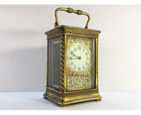 A French brass carriage clock with key (1 side glass a/f).