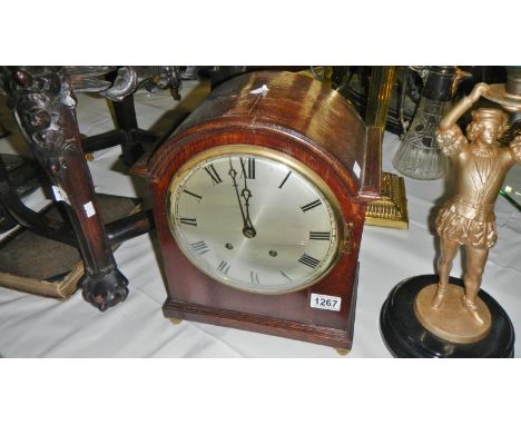 An oak bracket clock with key &amp; pendulum