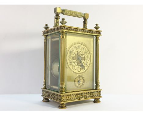 A Victorian brass carriage alarm clock with key.