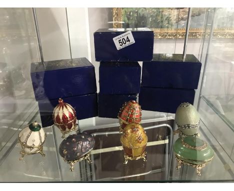 7 boxed "History of Faberge' Eggs" trinket boxes.
