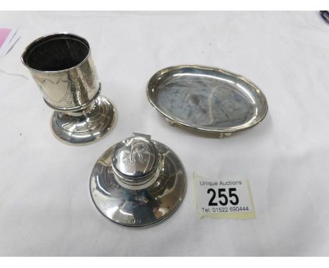 A silver inkwell, a silver pin dish and a silver toothpick holder.