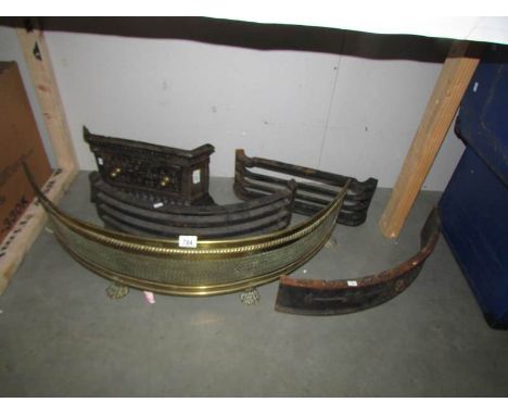4 cast metal fire fronts and a brass fender.