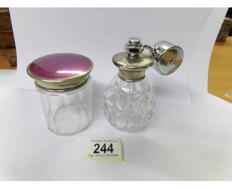 An art deco atomiser and an enamel topped pot.