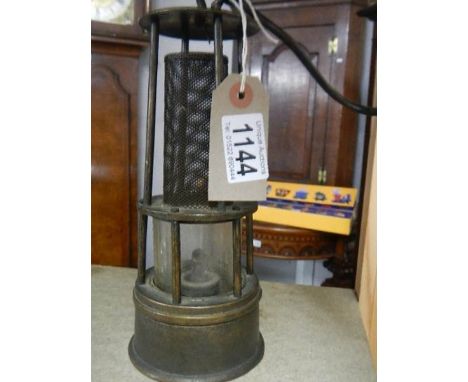 A rare early miner's lamp.