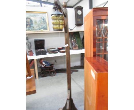An oak lantern style floor lamp.