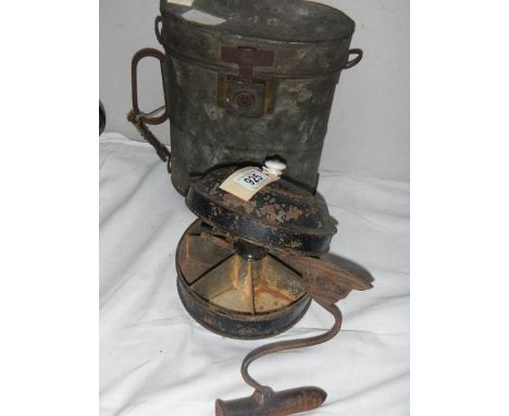 A 19th century cast iron goffering iron, a spice tin with grinder etc.,