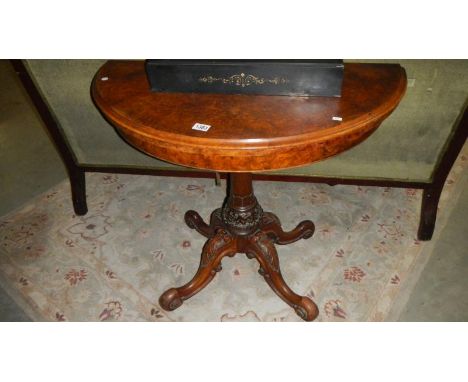 A walnut Victorian round card table