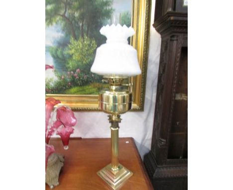 A tall Victorian brass oil lamp 1860-1900.  Corinthian column sitting on a stepped brass base with an all brass font, brass l