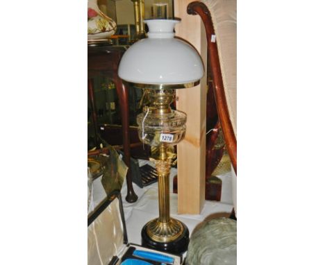 A large Victorian brass oil lamp 1860 - 1900. Reeded column with a spectacular Corinthian capitol holding a lovely cut glass 