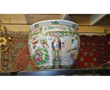 A large Chinese fish bowl planter marked made in China underneath