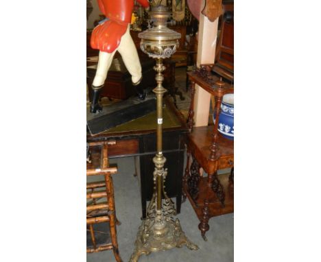 A very heavy ornate brass standard oil lamp