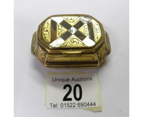 A 19th century snuff box inlaid with mother of pearl and tortoise shell.