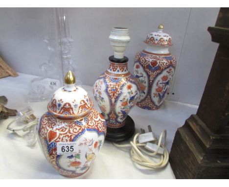 2 oriental style lidded jars and a table lamp base.