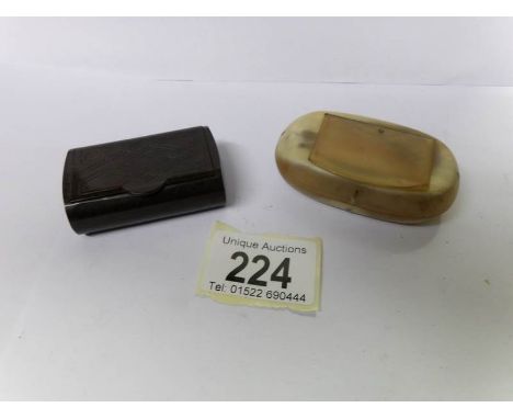 A 19th century horn snuff box and a bakelite snuff box.