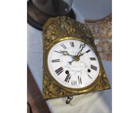 A 1900's French Meunier porcelain clock movement with bracket for wall mounting.