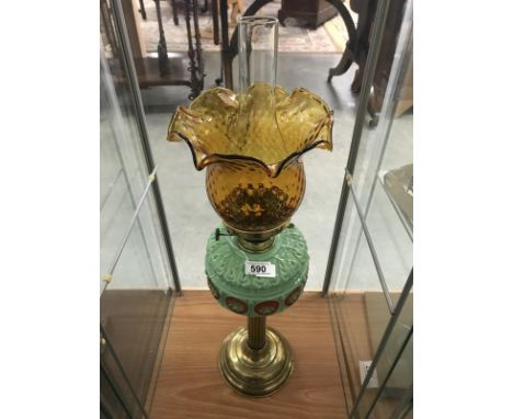A Victorian parlour oil lamp, circa 1890. Light green moulded glass vessel with hand painted rondels in brown/orange with a m