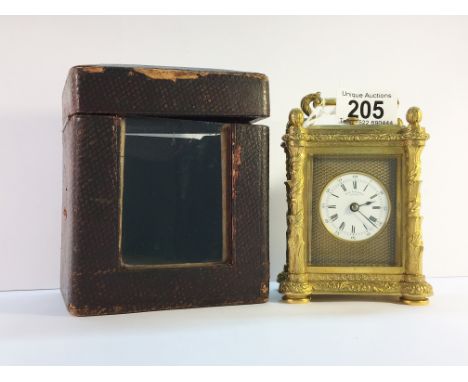 A Hunt and Roskell brass repeater carriage clock in original case.